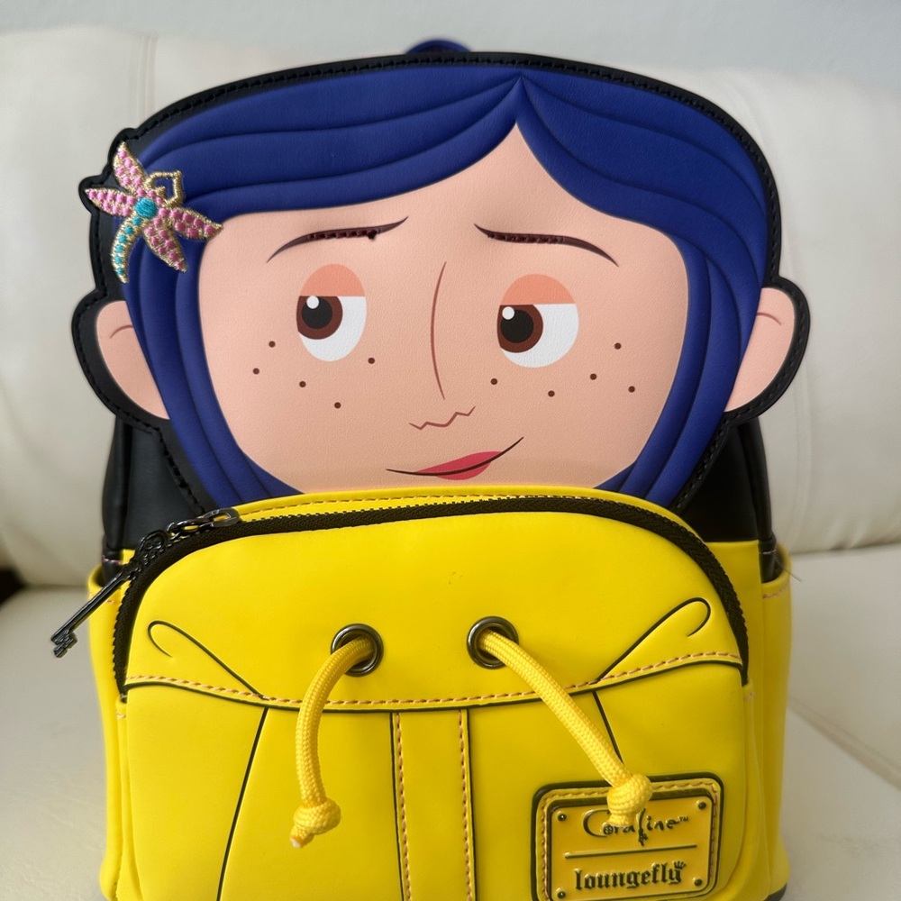 Loungefly Kids Yellow Coraline Face Mini Backpack with Blue Hair Accent